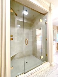 A Frameless Glass Shower Enclosure - Gold Tone Hardware - Her Bathroom