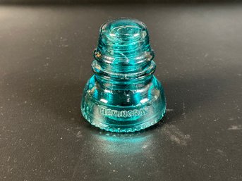 A Collectible Hemingray Glass Insulator In Blue