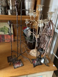 SIX METAL CANDLE HOLDERS AND A METAL TREE