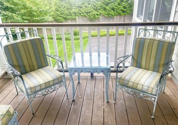 Pair Of Wrought Iron Chairs With Thick Zippered Cushions And Cast Aluminum Table With Glass