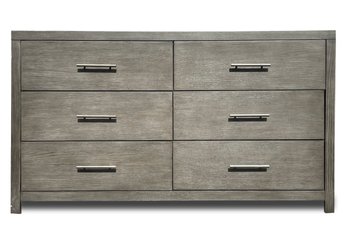 A Modern Chest Of Drawers With Sun Bleached Oak Finish