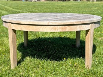 A Large Modern Teak Coffee Table With Umbrella Hole By Kingsley-Bate