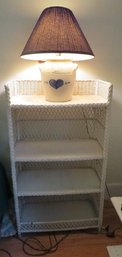 A Wicker 3 Shelf Bookcase With Stoneware Lamp