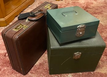 Two Metal Boxes And A Brief Case