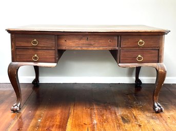 An Antique Grained Mahogany Veneer Clawfoot Desk