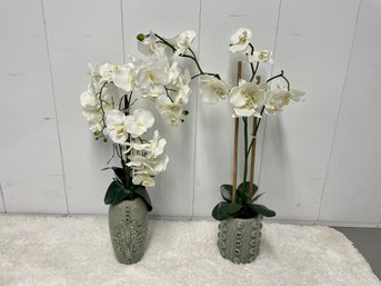 Two Realistic Faux Orchids In Coordinating Vases