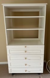 Custom-Made White Shelving Unit With Four Drawers And Pull Out Desktop On Rollers For Easy Transport