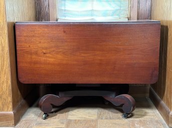 An Antique Drop Leaf Table