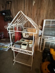 A ROLLING CAST METAL PLANTING TABLE