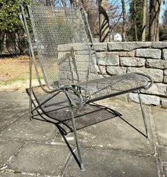 A Vintage Woodard Mesh Sling Outdoor Chair
