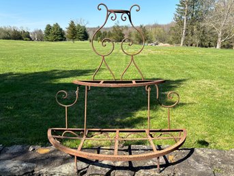 An Antique Cast Iron Three Tiered Demi-Lune Plant Stand