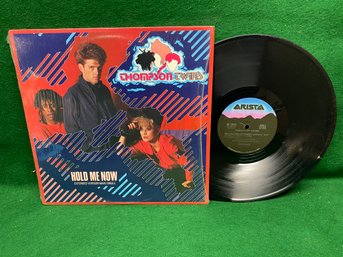 Thompson Twins. Hold Me Now On 1984 Arista Records.