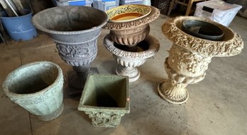 FOUR COMPOSITE AND TWO POTTERY URNS