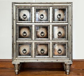 A Glam Dresser With Mirrored Paneled Drawers