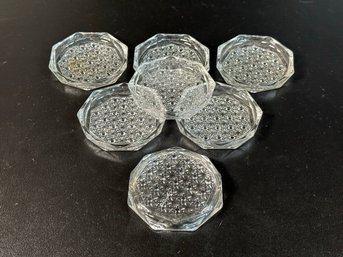 A Set Of Vintage Coasters In Pressed Glass