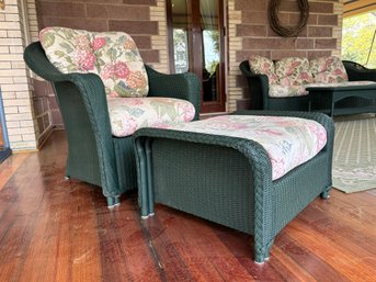 A Wicker Arm Chair And Ottoman By Lloyd Loom