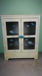 Rustic Cabinet With Fish Painted On Doors