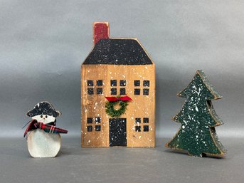 A Charming Winter Display: Snowman, Tree & House