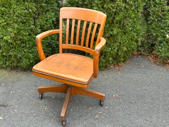 A Vintage Solid Oak Swivel Chair
