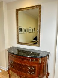 A Beautiful Beveled Mirror With Gold Toned Frame