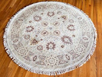 A Round Hand Knotted Wool Indo-Persian Area Rug