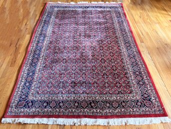A Hand Knotted Wool Indo-Persian Area Rug