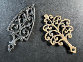 A Pair Of Vintage Cast-Metal Trivets