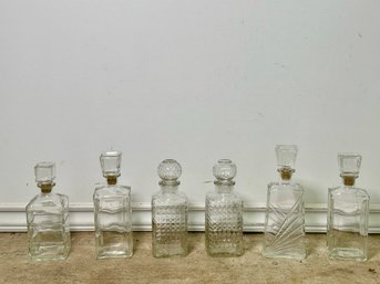 A Collection Of Glass Decanters