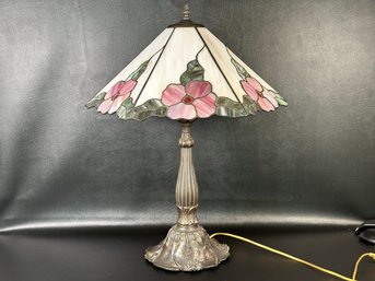 A Beautiful Table Lamp With A Slag Glass Shade