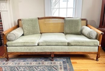 A Late 19th Century Carved Mahogany Cane Back Sofa With Carved Chrysanthemum Details