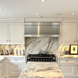 A Calcatta Monet Marble Backsplash - Fit 48' Range