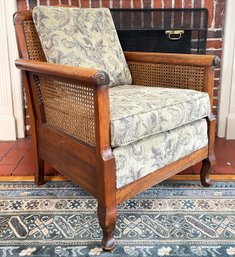 A Late 19th Century Carved Mahogany Cane Back Arm Chair With Carved Chrysanthemum Details