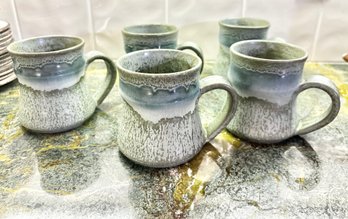 Four Stoneware Mugs