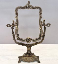 An Antique Bronze Mirror Frame