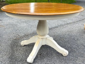 An Expandable Pedestal Base Dining Table By Ethan Allen