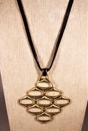 Art Moderne MCM Gold Tone Pendant On Leather Cord