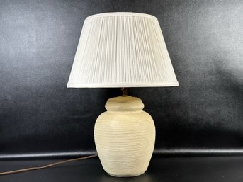 A Vintage Table Lamp With An Urn-Shaped Ceramic Body & Pleated Bell Shade