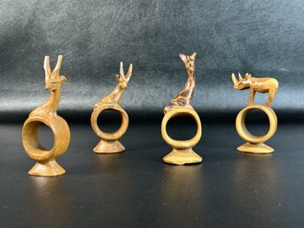 A Set Of Hand-Carved Vintage Wooden Napkin Rings With African Animals