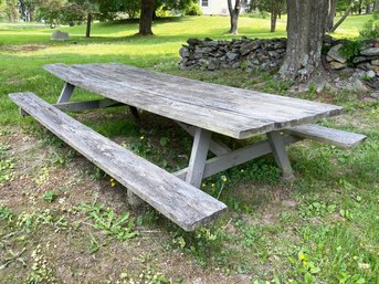 A Large Rustic Outdoor Picnic Table