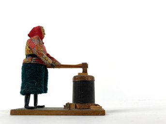 Interesting Vintage Souvenir - European Woman Chopping Wood In A Red Handkerchief