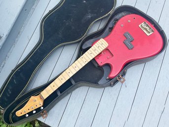 A Vintage Guitar Carcass And Hard Case