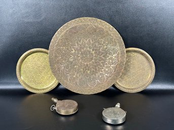 A Pair Of Antique Moroccan Powder Flasks & Three Vintage Etched Trays In Copper/Brass