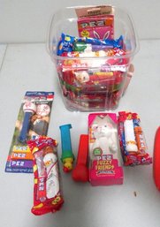 A Collection Of Pez Dispensers And Pez Candies, Many Still In Packaging