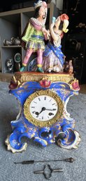 Antique European Porcelain Mantel Clock With Figurative Pediment