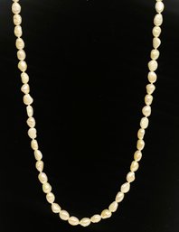 Long White Iridescent Fresh Water Pearl Necklace With Silver Clasp