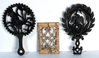 Trio Of Vintage Decorative Black Iron And Brass Trivets With Eagle & Heart, Rooster And More