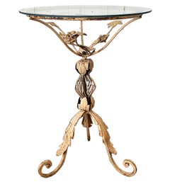 An Antique Wrought Iron Side Table With Glass Top