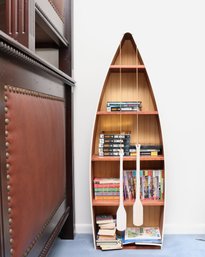 Blue And White Rowboat Bookcase With Decorative Oars