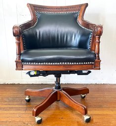 An Ornate Mahogany And Leather Office Chair