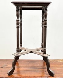 An Antique Turned Mahogany Plant Stand